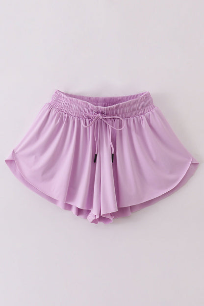 Purple woman sports shorts