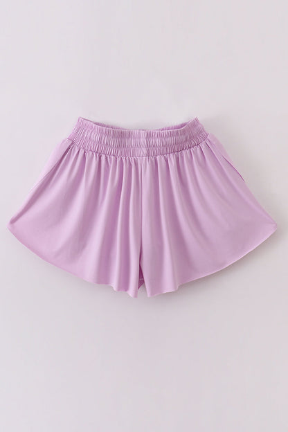 Purple woman sports shorts